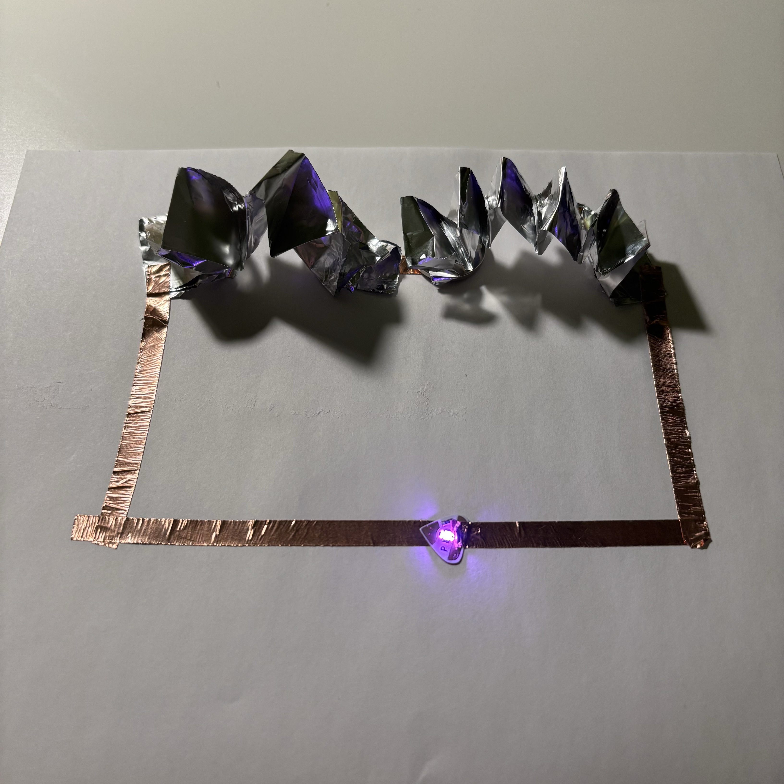 3D circuits are built successfully. I was very surprised & happy with the result. I think maybe I'll make a few more aluminum foil springs and stick them all over the circuit. In many tutorials, adding a 3D effect to a design relies heavily on origami, and this method I found opened up my mind.