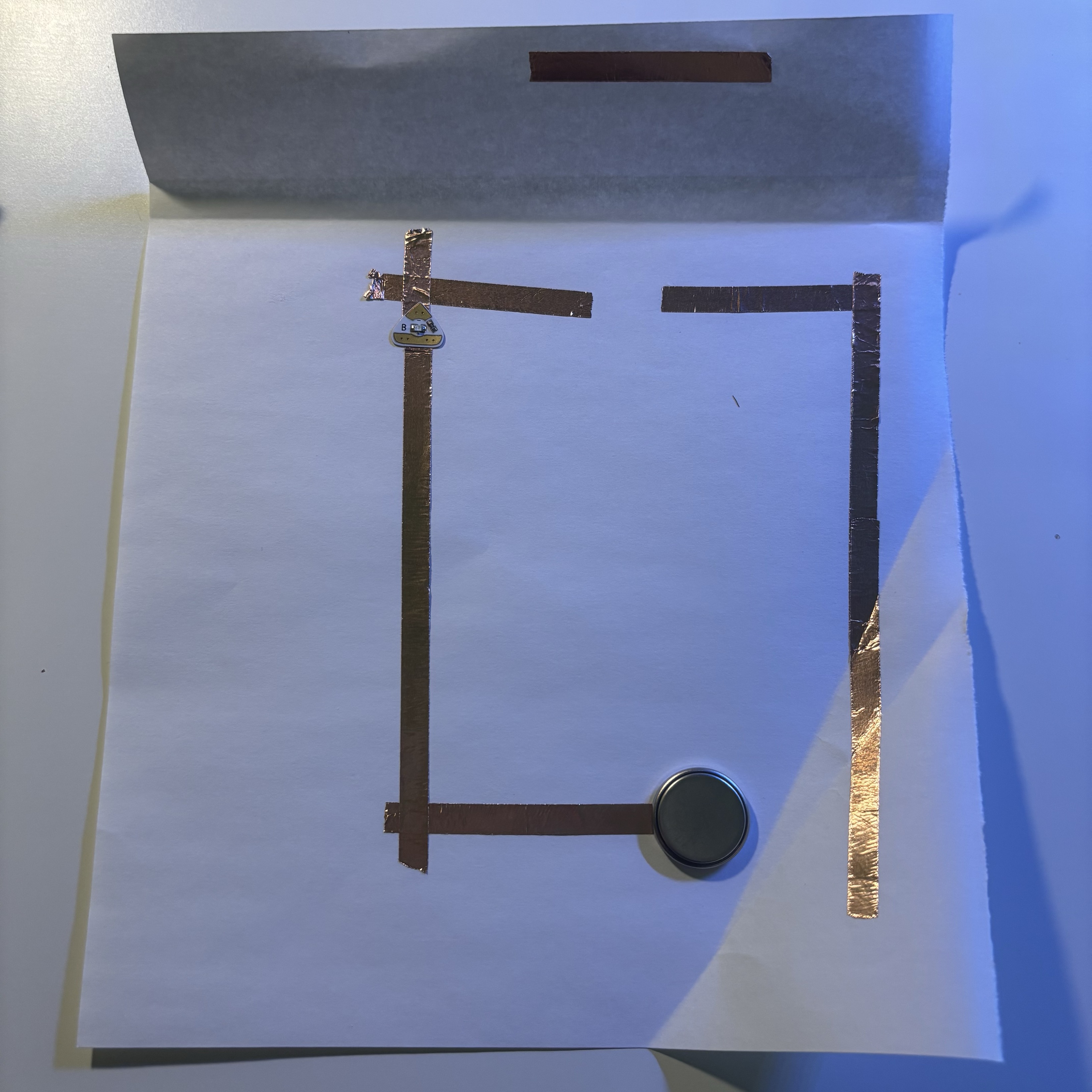 While such a circuit improves interactivity and fun, it also presents some difficulties in building. Because it must be ensured that the folded copper tape is positioned just so that it can ride on the circuit breaks, multiple adjustments may be required, and the conductors must be stabilized to avoid poor contact.