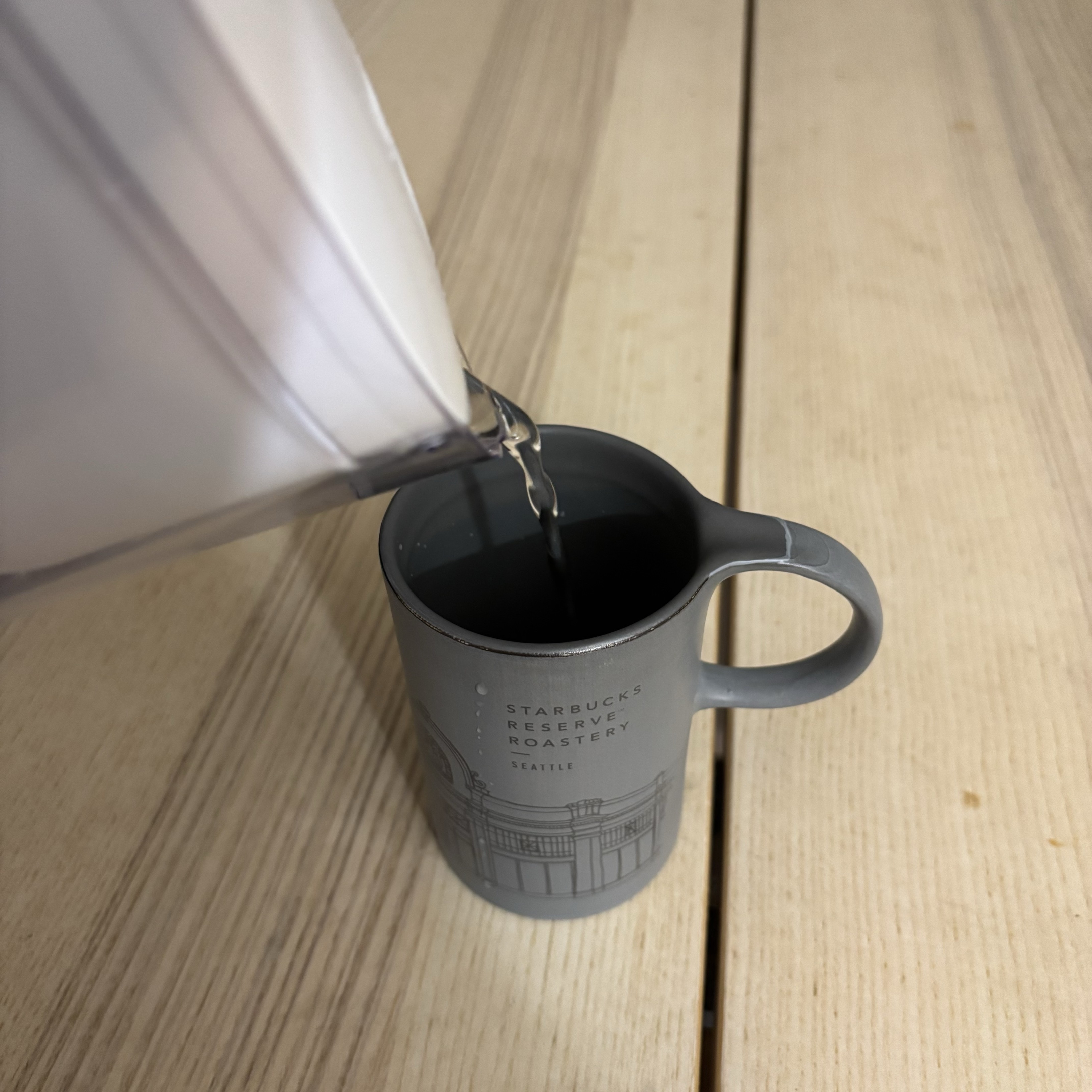 The sound of pouring water into a cup. If we listen carefully, we can notice that as the water level rises, so does the pitch of the sound.