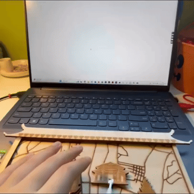 As shown in the GIF, users trigger sounds and visuals by touching the metal parts. However, this setup doesn’t allow the landmarks to be securely fixed to the map, which affects the overall aesthetics and completeness of the piece.