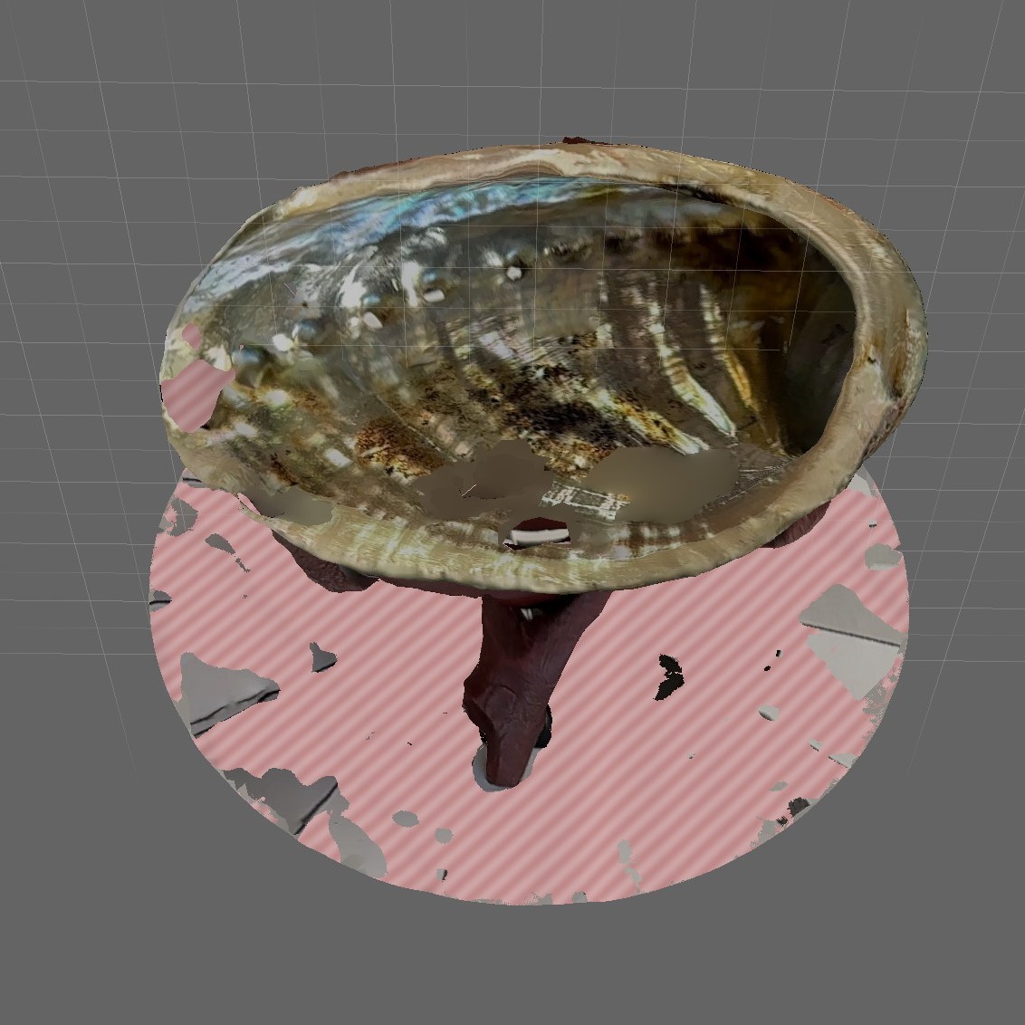 I use Meshmixer to repair the abalone shell. This is harder than several previous models because you can hardly tell where it's been repaired and how well. Maybe I need to rescan the abalone shell because after going through Activity 2, I've found that the secret to modeling success is an almost perfect scan.
