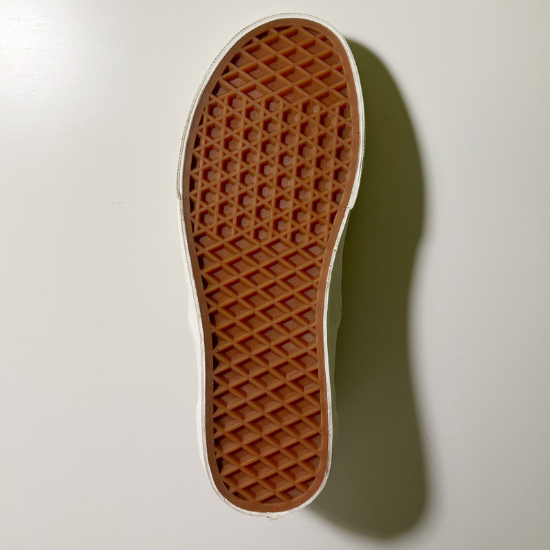 The bottom of the shoe, covered with many regular grid shapes.Repetitive tools could probably be applied.